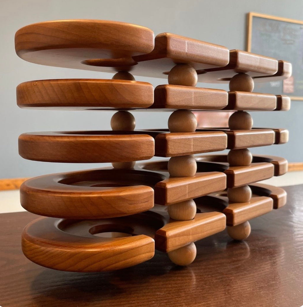 Stack of handcrafted wooden wine flight serving trays